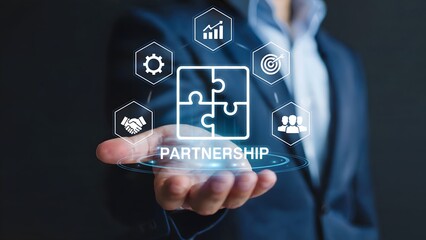 Business strategy presented in a conceptual display as a partnership, demonstrating successful collaboration, teamwork and common goal vision, held by a confident businessman in a suit.