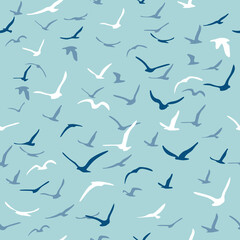 Flock of flying silhouette birds. Birds seamless pattern. White seagulls on a blue background. Vector
