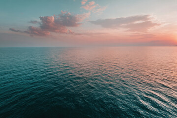 breathtaking aerial shot of oceanic surface at dawn showcasing serene and tranquil waters