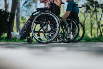 Two people in wheelchairs are depicted in an outdoor park environment, highlighting accessibility,...