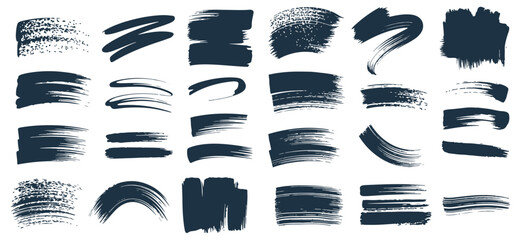 Collection of abstract brush strokes in dark ink on white background