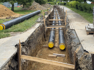 Underground installation of preinsulated district heating pipes in urban environment. Ideal for:...