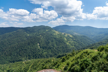 Mountain landscape with blue sky and clouds.