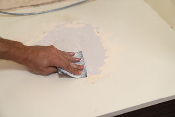Close up of sanding surface with paper.