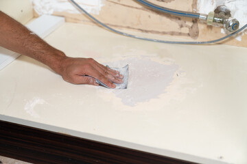 Close up of sanding surface with paper.