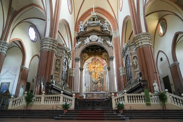Fototapeta premium Interior of a cathedral with stained glass windows and statues in Bologna Italy.