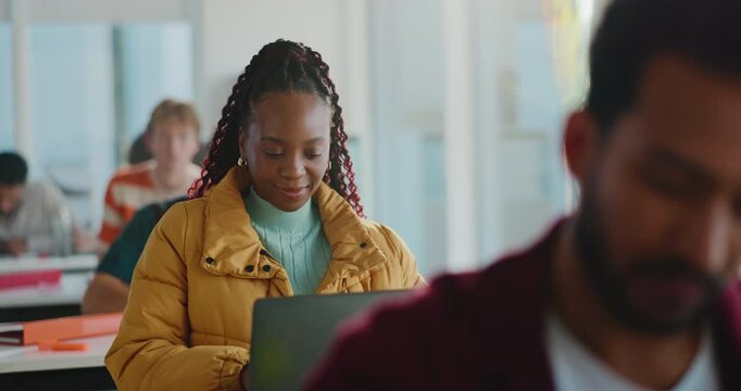 Laptop, thinking and students in college for exam, assignment or knowledge development in test. People, paper and English assessment in classroom with digital tech, course essay and research notes