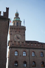 View of a historical clock tower in Bologna Italy.