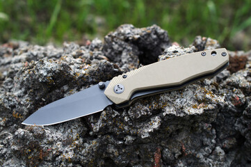 Folding tourist, camping knife with black blade and handle made