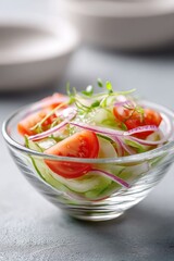 Fresh vegetable salad with tomatoes, cucumbers, and onions in a bowl