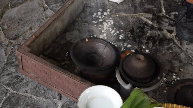 Closeup of a man's hands cooking Serabi Indonesian food