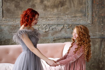 Two beautiful girls with red hair. sisters. friends