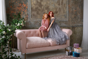 Two beautiful girls with red hair. sisters. friends
