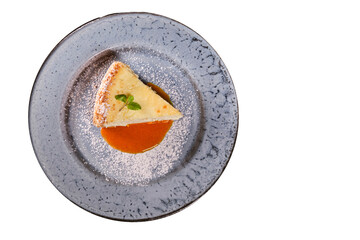 slice of cheesecake on blue plate. top view. tasty breakfast