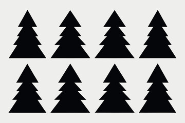 Obraz premium Silhouettes of evergreen trees in a forest setting 