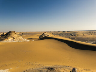 White rock formations and sand dunes in Egypt's White Desert, natural desert landscape	
