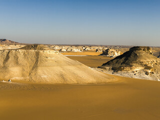 White rock formations and sand dunes in Egypt's White Desert, natural desert landscape	