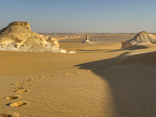 White rock formations and sand dunes in Egypt's White Desert, natural desert landscape	
