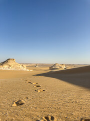 White rock formations and sand dunes in Egypt's White Desert, natural desert landscape	