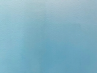 Blue textured wall with a rough and uneven surface. Design element
