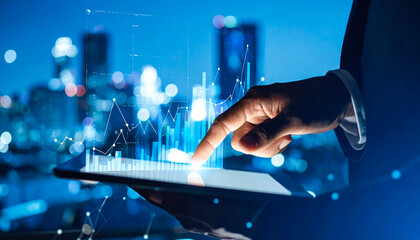 side view of hand businessman touching digital tablet with hologram chart on blue background