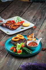 Steaks with seasoning and herbs