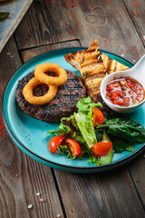 Steaks with seasoning and herbs