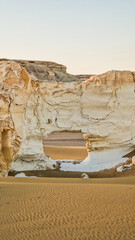 White rock formations and sand dunes in Egypt's White Desert, natural desert landscape	