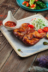 Steaks with seasoning and herbs