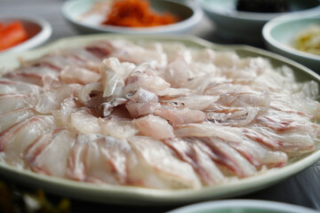 Freshly Sliced Korean Sashimi Platter. Raw Fish Served on a Plate