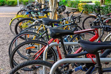 row of colourful bicycles pushbikes in bike rack