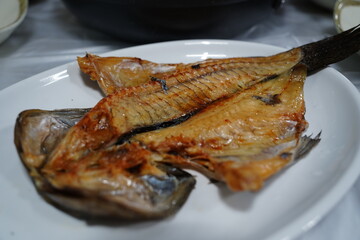 Grilled Mackerel Fish Served on White Plate in Restaurant
