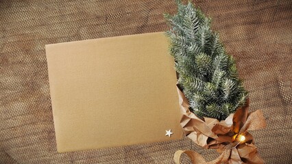 Christmas card without text. Blank cardboard sheet, artificial Christmas tree, paper decorations....