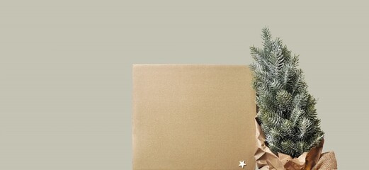 Christmas card without text. Blank cardboard sheet, artificial Christmas tree, paper decorations....