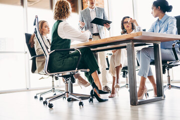 Teamwork in Progress as Business Professionals Hold a Collaborative Meeting in a Contemporary...