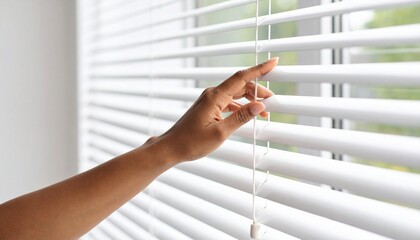 young woman looking through the window