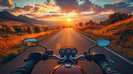 Motorcycle POV driving into a sunset. Mountains in the background and trees on either side of road