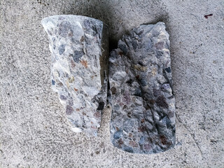 A broken concrete core sample after a compressive strength test. It's clearly display the internal...
