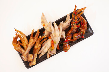 Three different ways to cook chicken feet isolated on white