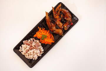 Sweet and spicy chicken feet with carrots and "samp"