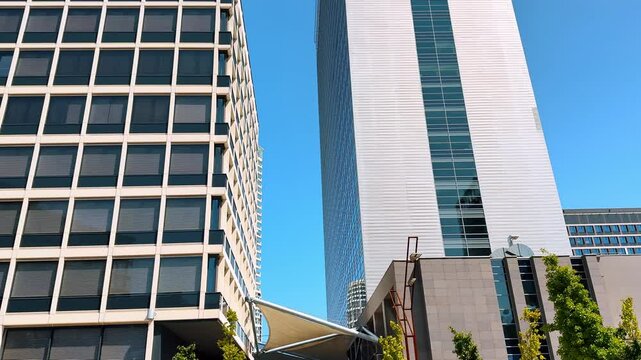 Multi-storied diverse buildings in the urban city. High-rise buildings at the backdrop of blue sky. Bratislava, Slovakia.