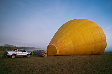 Hot air balloon, on ground, pre dawn sunrise, adventure tourism travel experience