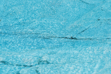 Abstract blue background. Blue rock with ripples on the surface. Defocus blurred transparent blue...