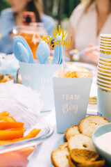 Sweet treats and savory snacks at a sunny baby shower gathering