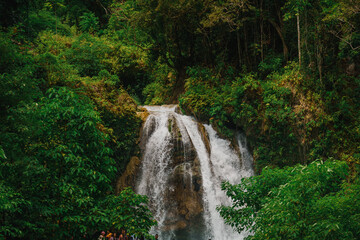 Close Scenic Wide View of Kawasan Falls Jungle Waterfall and Turquoise River in Cebu, Philippines
