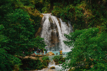 Close Scenic Wide View of Kawasan Falls Jungle Waterfall and Turquoise River in Cebu, Philippines