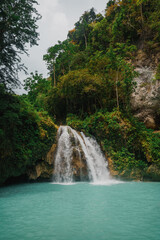 Close Scenic Wide View of Kawasan Falls Jungle Waterfall and Turquoise River in Cebu, Philippines