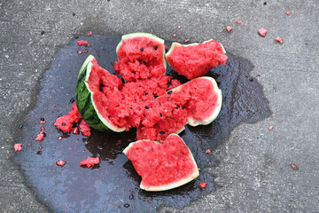 Close-up of a broken watermelon on the ground