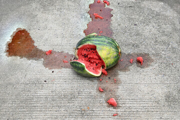 Close-up of a broken watermelon on the ground