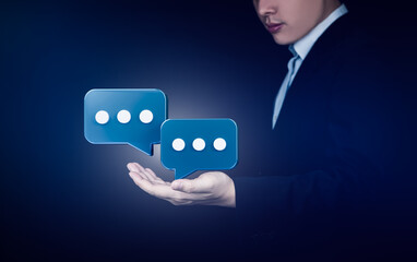 Businessman showing 3D speech bubbles talking on hands. Concept of communication network and services, online support.